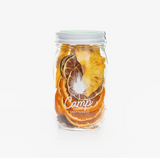 Camp FloRita cocktail kit with dried pineapple, orange, lime, hibiscus, and logo.