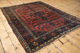 Angled perspective of a collector Lilihan carpet showing the entire sprawling tree of life pattern.