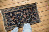 Antique Mehriban rug’s dark blue field with geometric trefoil plants and textured pile.