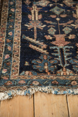 Frayed end and geometric blue, beige, and mauve border of Antique Mehriban rug.
