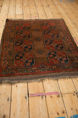 Detail of the vintage Beshir rug's multi-color banded border and goat hair selvage.