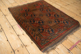 Hand knotted Turkmen Beshir rug corner with goat hair selvage and rhythmic alternating red and navy border.