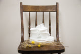 Vintage white milk glass plates and cups with an embossed grapevine design.