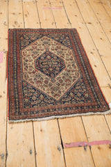 Antique Senneh rug corner, showcasing fine Herati motifs, terracotta border, mostly even wear.