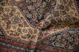 Rolled antique Senneh rug showing tight knotting, Herati motif, ivory, navy, terracotta pile.