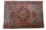 Vintage Heriz carpet with oversized concentric medallion in aged blush, navy, and sky blue, 8'2