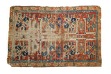 Antique Caucasian fragment rug, circa 1890s, with cherry red, sky blue guls, hook and latch border, and exposed foundation.