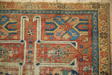 Antique Caucasian rug: cherry red guls, sky blue hook border, and extensive visible foundation.