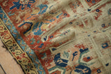 Worn foundation and tattered edge on antique Caucasian rug with cherry red, navy, hook and latch border.