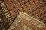 Hand-knotted Mir Serbend rug, revealing rusty red pile and tightly woven reverse.