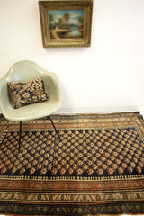 Kurdish Bijar rug with golden Mir motif field and unique pawn-like laleh abassi border.