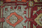Low pile and visible knot heads of a vintage Oushak carpet's geometric design.