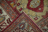 The hand-knotted back and original side cord selvage of a vintage Turkish Oushak carpet.