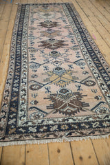 Vintage Hamadan runner with chocolate brown Herati palmette motifs on dusty blush.