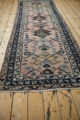 Vintage Hamadan rug runner end with ivory machine-finished fringe and dark navy geometric border.