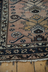 Machine finished fringe of vintage Hamadan rug, revealing dusty mauve pile with even wear.