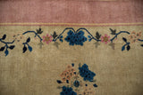 Nichols Art Deco rug detail: mauve border band, antique ivory field, blue vinery, pink blossoms.