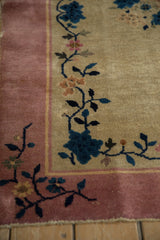 Art Deco rug corner, featuring cobalt blue flowers, delicate vinery, and dusty pink border.