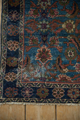 Fine vintage hand knotted Hamadan rug corner, displaying distressed blue Herati pattern and fringe.