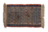 Antique Kurdish rug mat: ivory trellis, germinating plants, navy, rust, sky blue border, faux fringe.