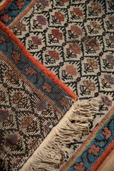 Detail of Kurdish rug's foundation, showing faux fringe attached to woven pile.