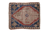 Antique Caucasian square rug, central geometric medallion, primitive designs in beige, red, and blue.