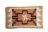 Southwestern Navajo rug, dusty coral field, starburst and geometric stepped design. 2'1