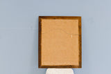 Back of the vintage Thomas Kerry painting's dark wood frame and masonite.