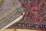 The hand-knotted construction of a Persian Lilihan rug, showing the pile and foundation.
