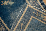 Antique Peking rug's visible foundation, highlighting areas of wear to the cobalt blue pile.