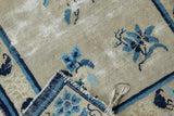 Visible foundation and wear across knot heads on antique Peking rug, tattered end.