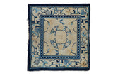 Antique Peking square rug, cream field, cobalt blue floral roundel medallion, geometric borders.