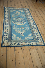 Worn corner of antique Peking runner, sky blue field, cobalt T border, antique ivory florals.