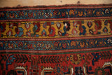 Intricate geometric borders of an antique Kurdish Bijar rug with brilliant saffron and sapphire tones.
