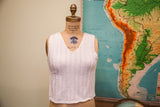 Vintage 70s white knit cropped top with zigzag pattern and V-neck.