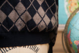Black and brown argyle pattern with Fendi FF logos and ribbed hem detail.