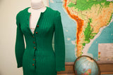 Textured green knit of the vintage 60s dress, featuring wooden buttons.