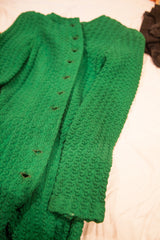 Textured bright green fabric and brown wooden buttons on a vintage 60s Betsey Johnson dress.