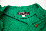 Betsey Johnson Paraphernalia label on a vintage green textured knit dress with wooden button.
