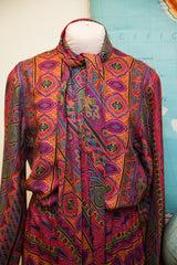 Vibrant psychedelic pattern on the pleated skirt of the Vintage 70s Oscar de la Renta dress.
