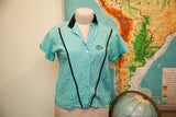 Vintage light turquoise bowling shirt featuring 'Alice' embroidery and black V-stripe detail.