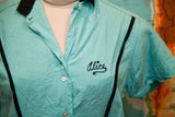 Embroidered black 'Alice' script detail on vintage turquoise bowling shirt.