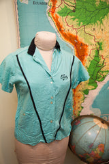 Vintage turquoise 50s bowling shirt close-up, showing 