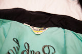 Vintage 50s bowling shirt's Crown Prince brand label, light turquoise with black collar.