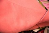 Small imperfections shown on the soft pink wool texture of the vintage Versace coat.