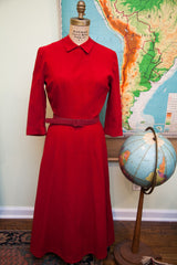 Maroon 1940s wool dress showcasing A-line silhouette and Peter Pan collar.
