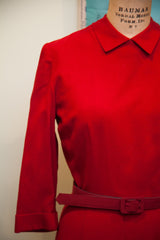 Burgundy wool dress waist with matching belt and small dark spot detail.