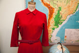 Burgundy Peter Pan collar dress with cuffed sleeves and matching belt.