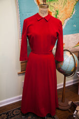 Burgundy red vintage 1940s dress featuring a Peter Pan collar and cuffed sleeves.