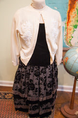 Vintage 50s ensemble skirt with black velvet roses and fringed tiers.